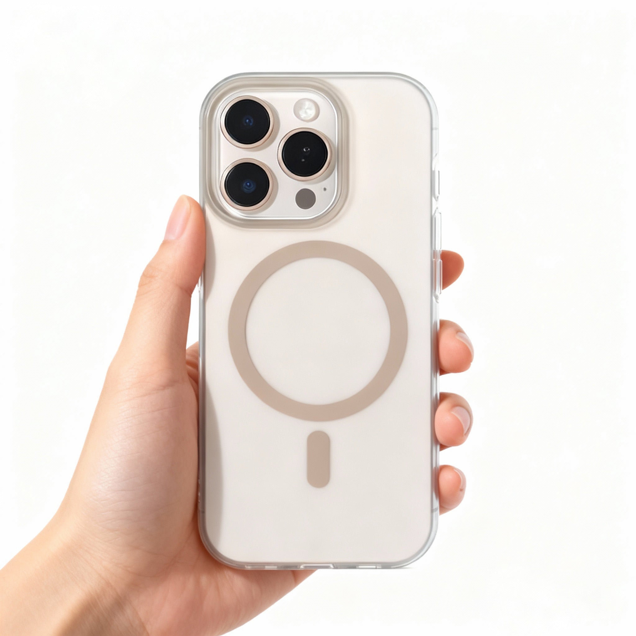 Hand holding iPhone 16 Pro Max with clear MagSafe case showing Desert Titanium ring detail